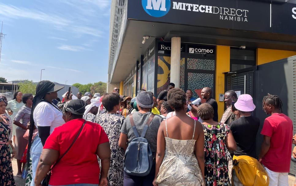 Disgruntled residents infront of Redforce offices